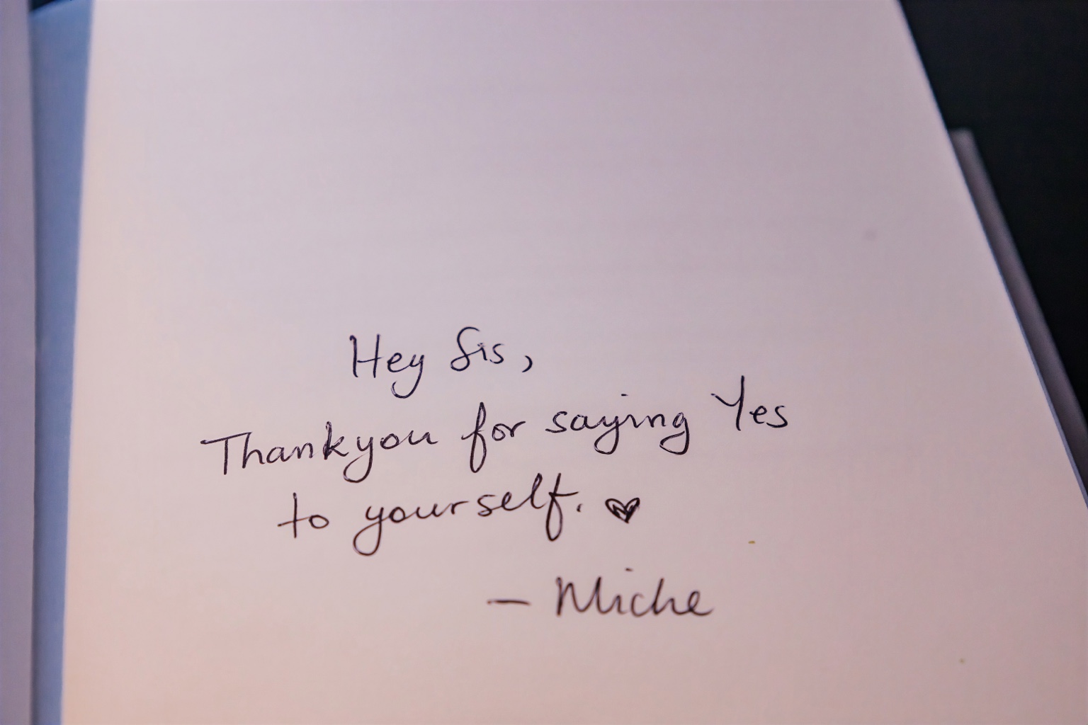 A handwritten note thanking a woman for saying yes to herself